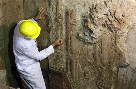 An archaeologist works on a mosaic discovered in downtown Rome.